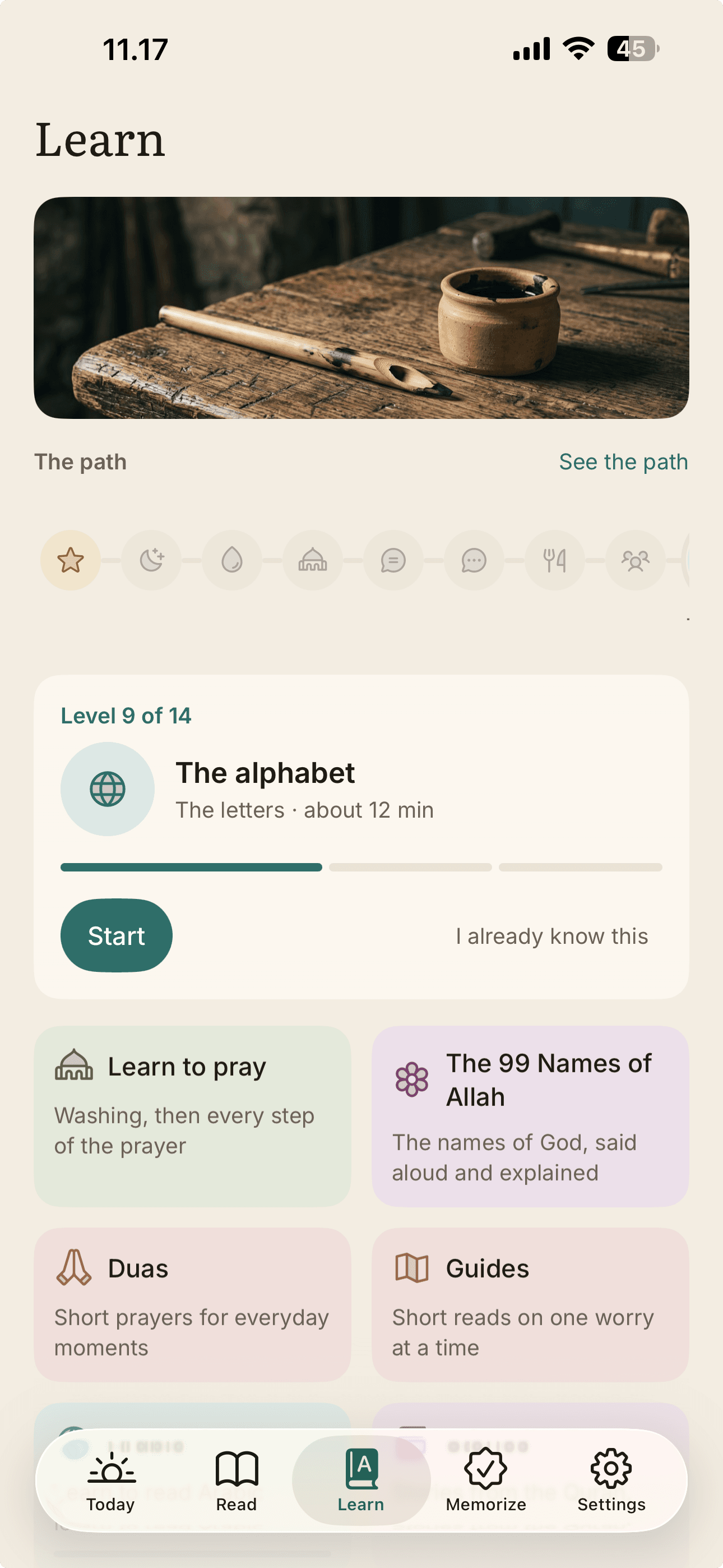 The Learn tab: a path through fourteen levels, currently on the alphabet